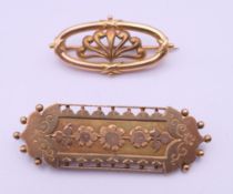 A 9 ct gold brooch (3.9 grammes total weight) and a 15 ct gold brooch (3.6 grammes). Largest 4.