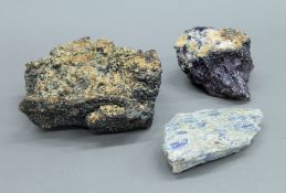 Three mineral specimens , including one possibly Blue John and one possibly kyanite.