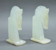 A pair of onyx horse head bookends. 19 cm high.