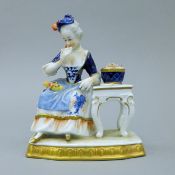 A 20th century Unter Weize Bach porcelain figural group, after a Meissen original. 15 cm high.