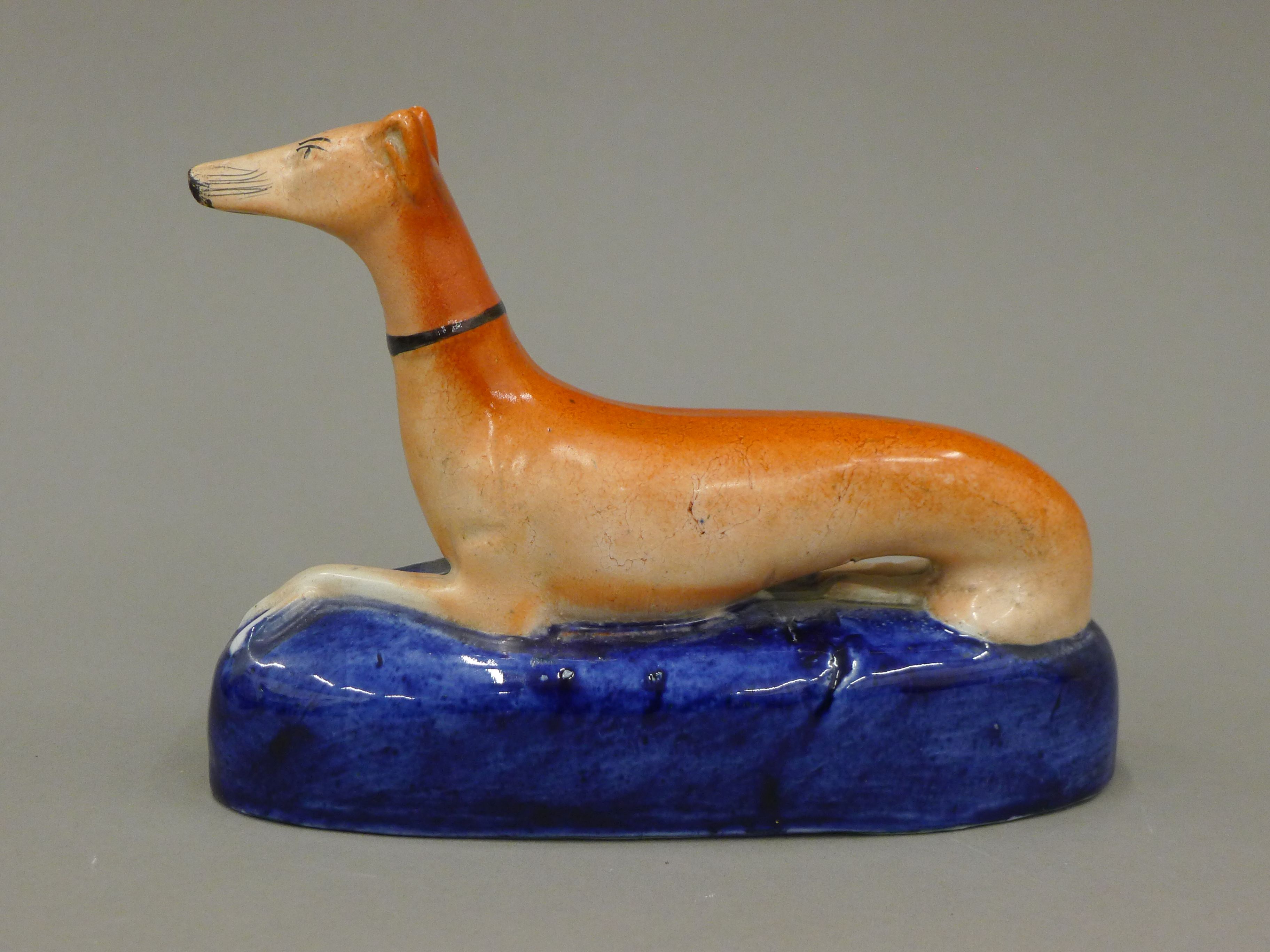 A pair of 19th century Staffordshire pottery models of coursing greyhounds, - Image 6 of 7