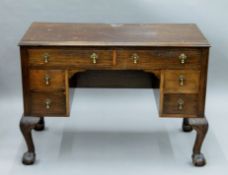 An early 20th century walnut desk. 102 cm wide.
