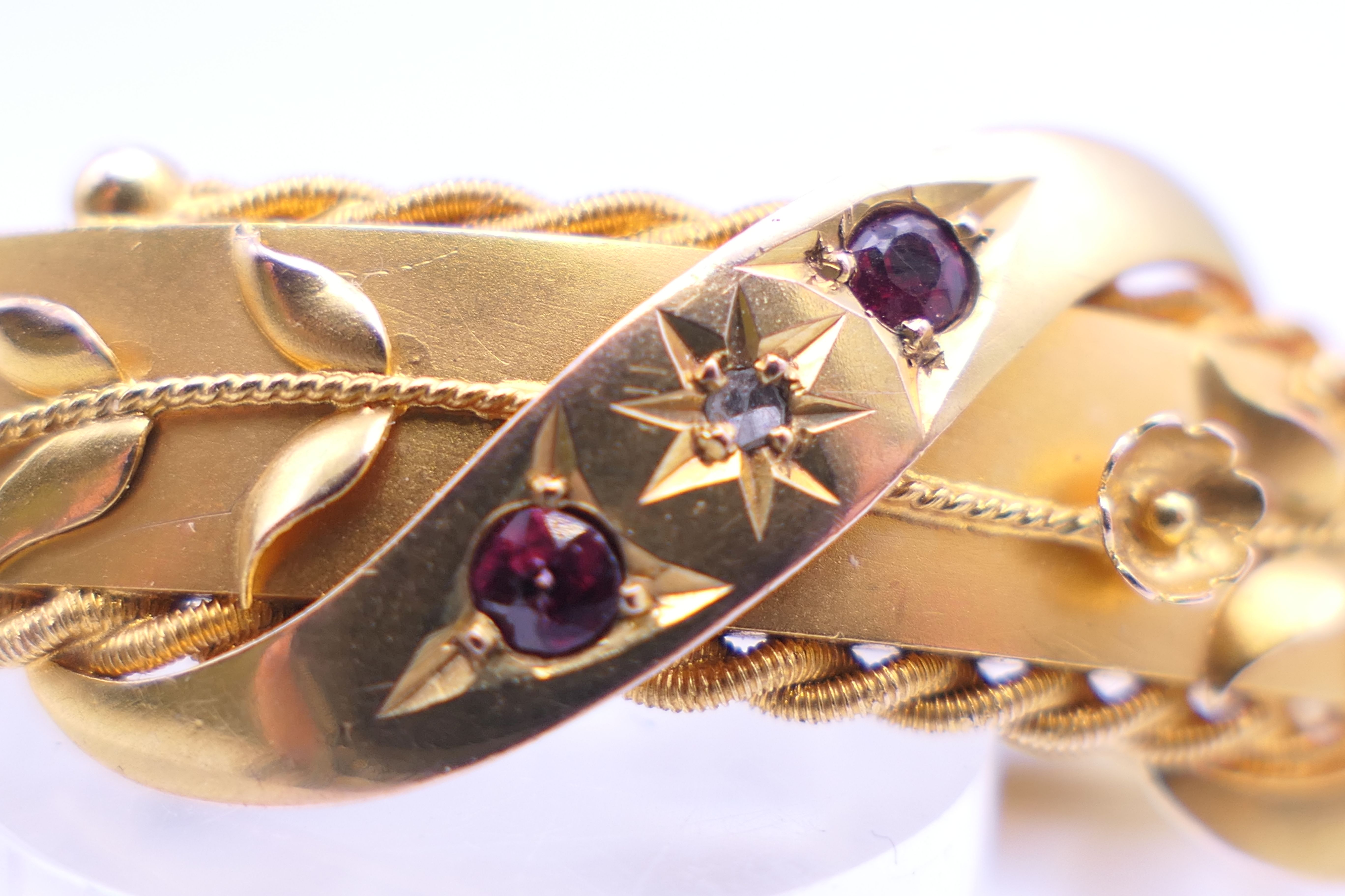 A 9 ct gold diamond and ruby bangle form bracelet. 6 cm internal diameter. 11. - Image 7 of 10