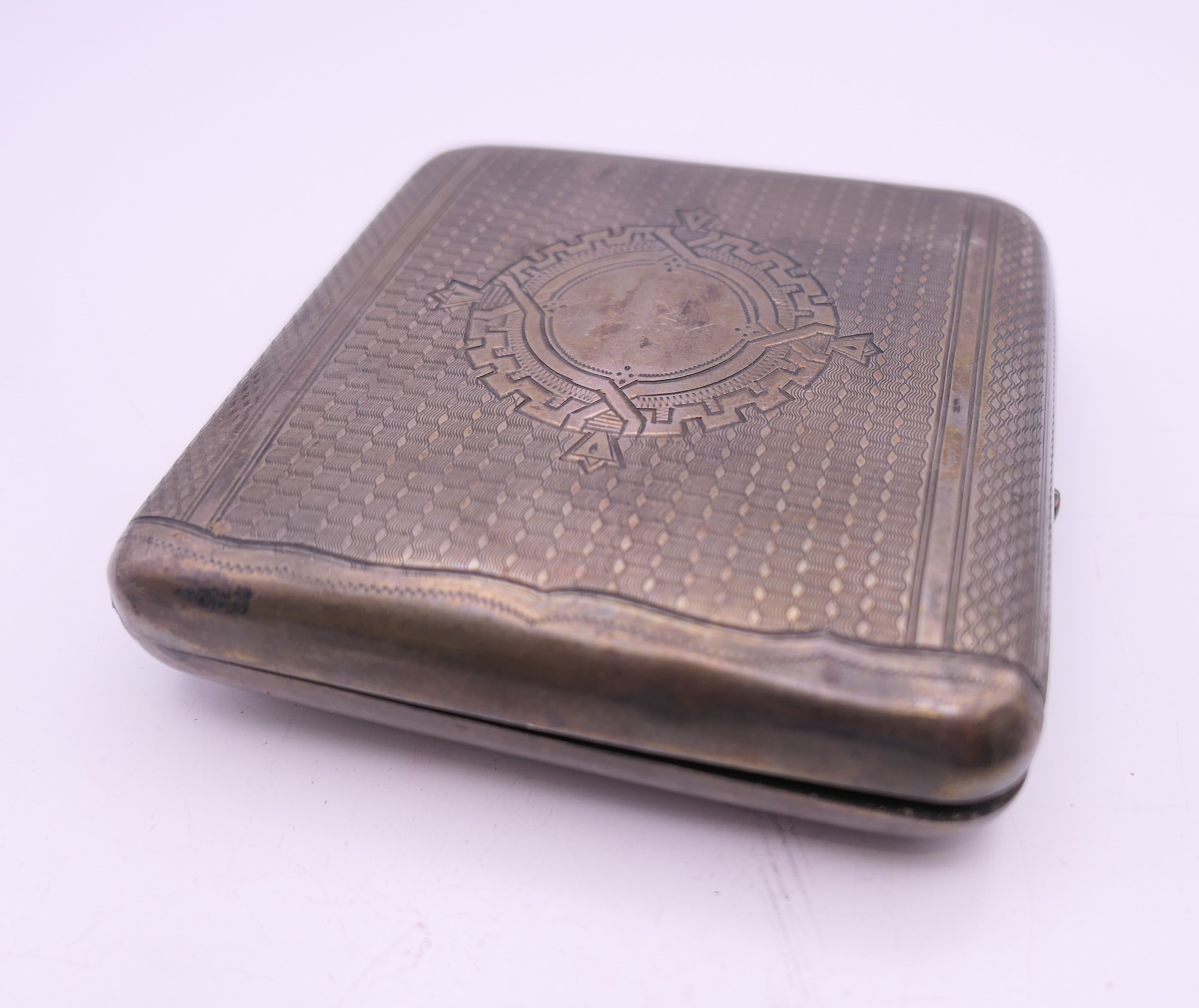 A Russian silver cigarette case. 8.25 x 8.5 cm. 120.5 grammes total weight. - Image 4 of 6