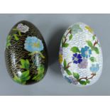 Two cloisonne eggs. Each approximately 10 cm high.