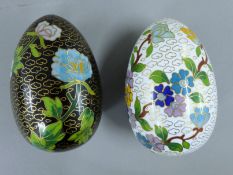 Two cloisonne eggs. Each approximately 10 cm high.