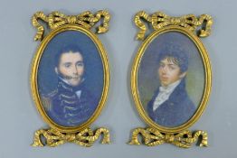 A pair of gilt framed miniatures. 23 cm high overall.