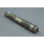 A Tibetan 800 silver prayer scroll holder. 30 cm long.