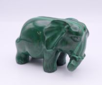 A malachite model of an elephant. 6 cm long x 4 cm high.
