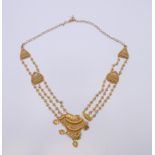 An unmarked Eastern high carat gold, possibly 22 ct, necklace. Approximately 53 cm long. 27.