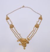 An unmarked Eastern high carat gold, possibly 22 ct, necklace. Approximately 53 cm long. 27.