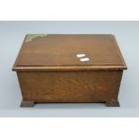 A brass mounted oak sewing box. 32 cm wide.