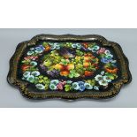 A large toleware tray decorated with birds, fruit and flowers. 75.5 cm long.