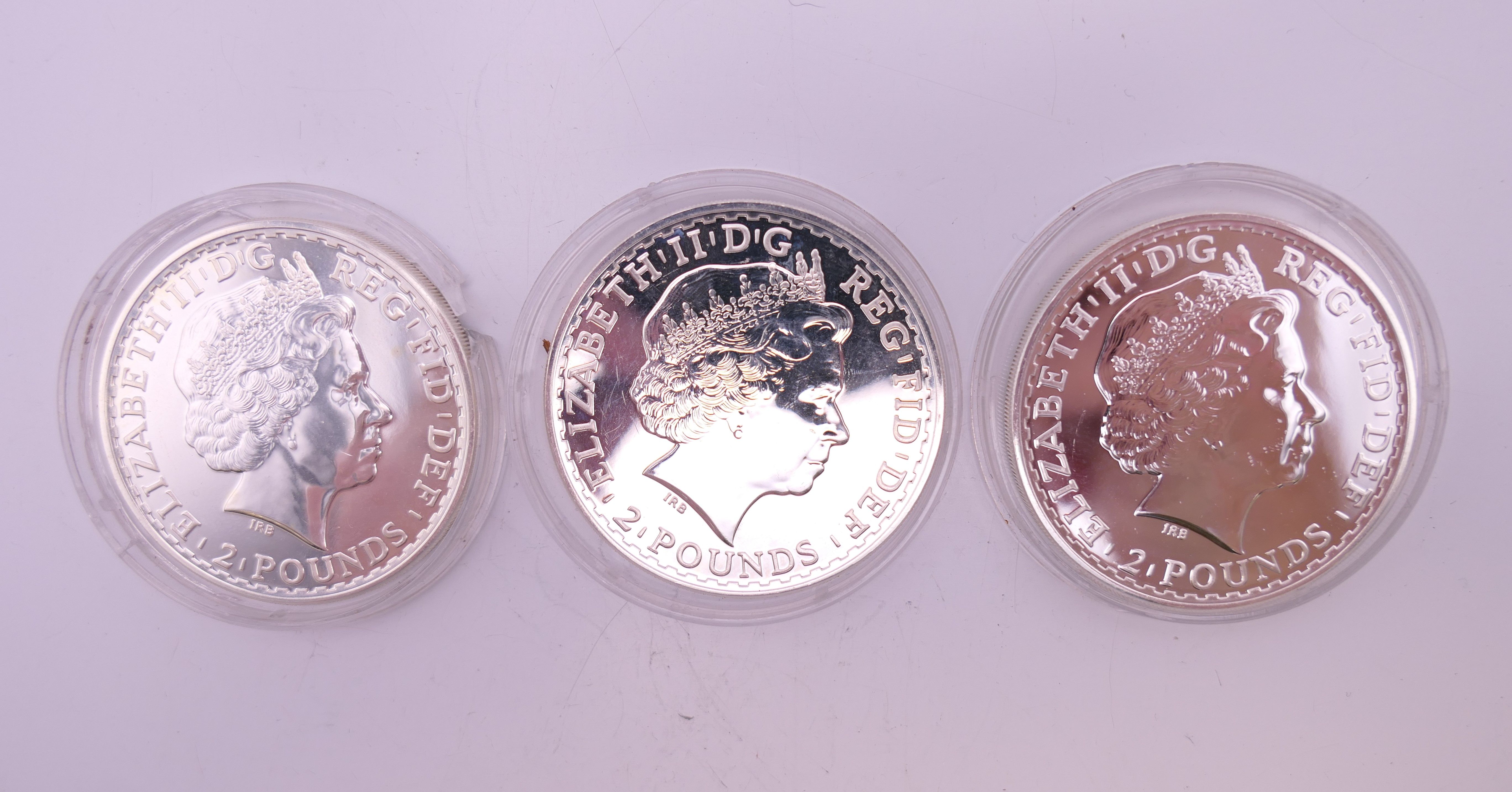 Three silver 2013 one ounce Britannia coins and a silver 1881 one dollar coin. - Image 3 of 5