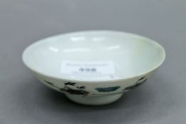 A 19th century Chinese porcelain lid. 9.25 cm diameter.