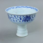 A Chinese blue and white porcelain stem cup. 9 cm high.