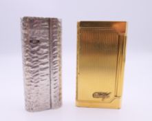 A Dunhill lighter and a Davidoff lighter. The former 6.5 cm high.