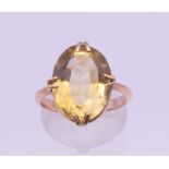 A 9 ct gold citrine ring. Ring size I/J. 4.4 grammes total weight.