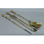 A set of three Victorian brass fireirons. The shovel 70 cms long.