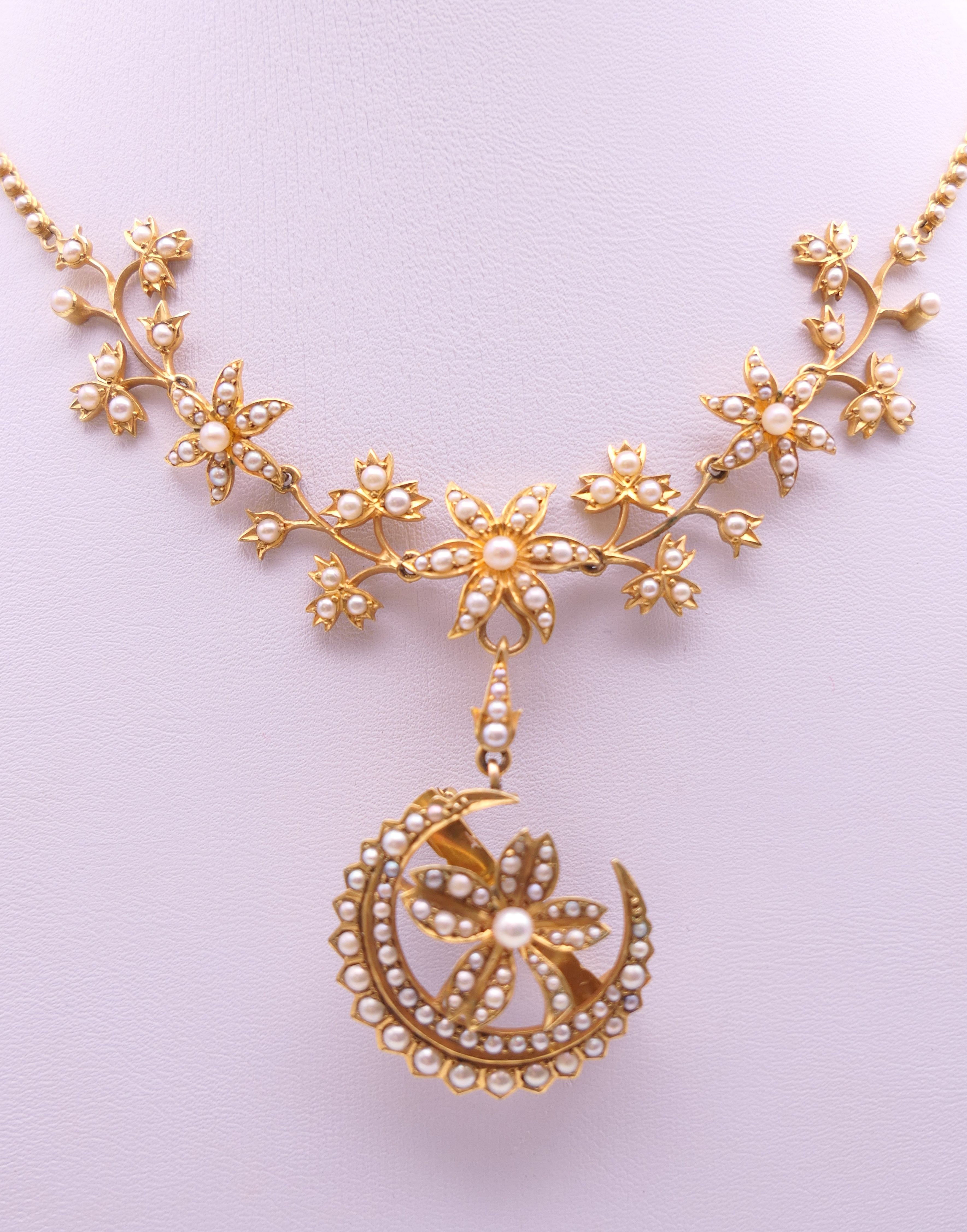 An unmarked gold seed pearl set necklace of scrolling floral form and detachable pendant formed as - Image 5 of 16