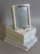 Five various boxed modern photograph frames. The largest approximately 20 x 25 cms.