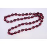 A bead necklace 84 cm long.