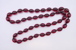 A bead necklace 84 cm long.