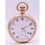 A gold plated open face pocket watch. 5 cm diameter.