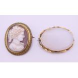 A 19th century cameo brooch carved with the bust of a lady and another brooch. Cameo 4.