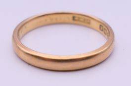 A 22 ct gold wedding band. Ring size M. 3.4 grammes.