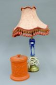 A Victorian terracotta lidded pot and a table lamp. The former 16.5 cm high.