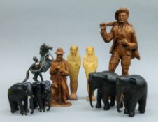A box of various model figures, elephants, etc.