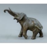 A spelter model of an elephant and a lidded censer formed as an elephant. The former 22 cm high.