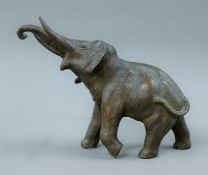 A spelter model of an elephant and a lidded censer formed as an elephant. The former 22 cm high.