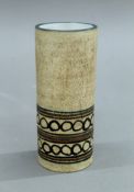 A Troika cylindrical vase. 15 cm high.
