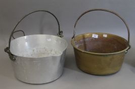 Two jam preserve pans, one brass and the other aluminium. The former 35 cm diameter.