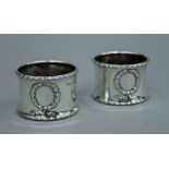 A pair of silver napkin rings, hallmarked for Birmingham 1911.