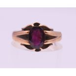 A 9 ct gold and garnet ring. Ring size O/P. 2.9 grammes total weight.