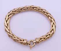A 9 ct gold bracelet. 19 cm long. 18.2 grammes total weight.