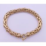 A 9 ct gold bracelet. 19 cm long. 18.2 grammes total weight.