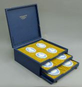 A collection of Wedgwood portrait medallions, boxed. The box 36.5 cms wide.