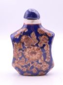 A Chinese porcelain snuff bottle. 6.5 cm high.