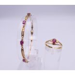 A 14 ct gold red stone and small diamonds ring and a 10 ct gold red stone set bracelet.