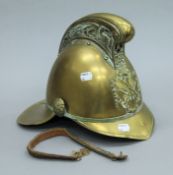 A vintage brass fireman's helmet. 26 cms high.