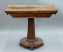 A Victorian mahogany card table. 91.5 cm wide.
