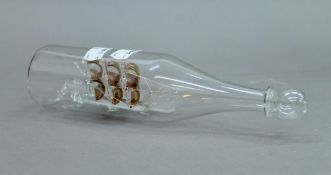 A glass ship in a glass bottle. 22.5 cm long.