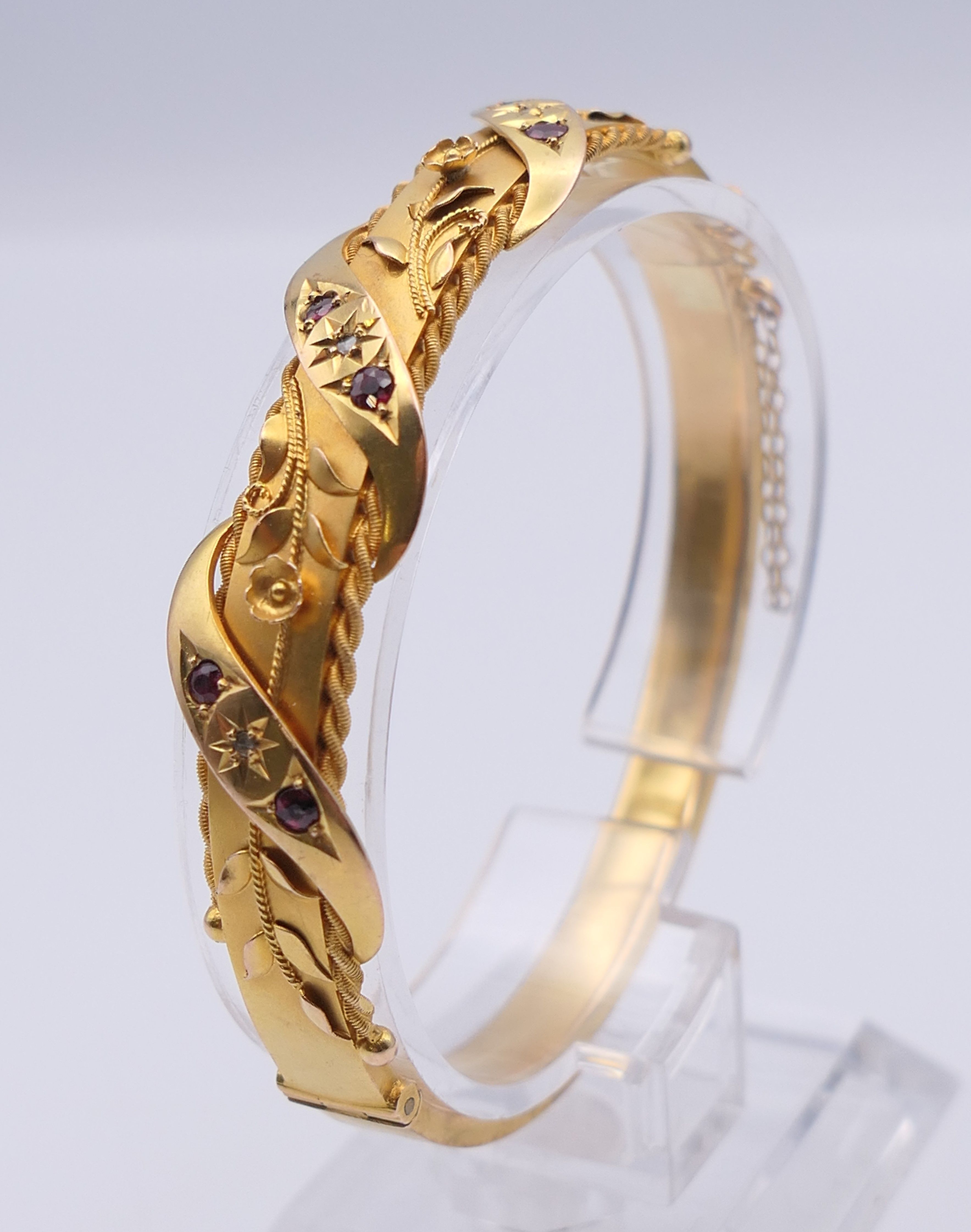 A 9 ct gold diamond and ruby bangle form bracelet. 6 cm internal diameter. 11. - Image 4 of 10