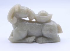 A jade carving of a goat. 8.