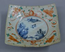 An Asian square pottery dish. 26.5 cm wide.