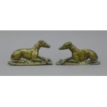 A pair of Victorian brass recumbent greyhound mantlepiece ornaments. 15 cm long.